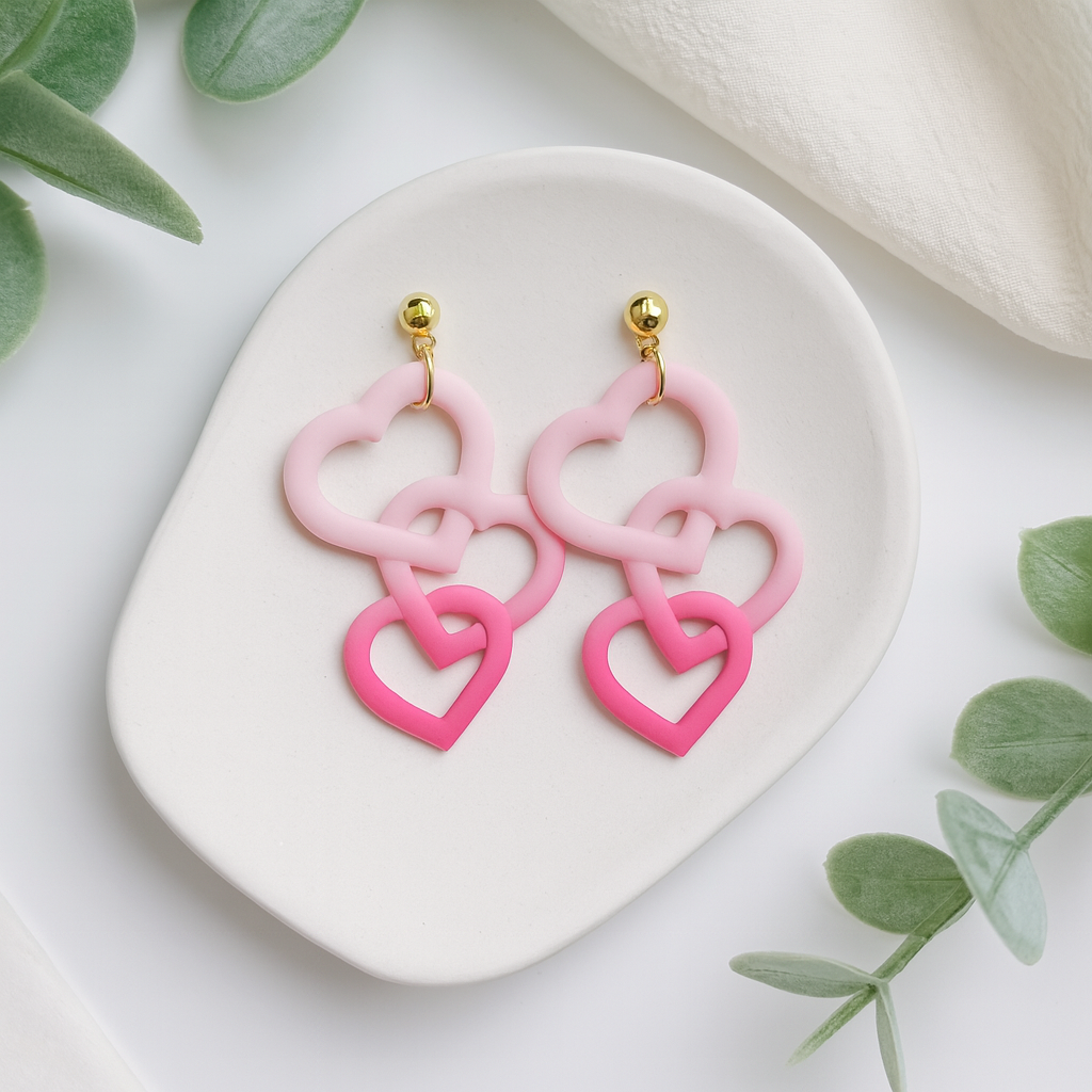 Interlocking Heart Dangle Earrings handmade using polymer clay