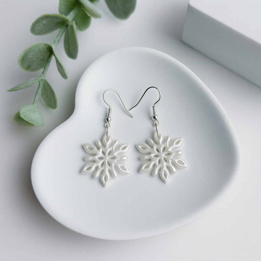 snowflake earrings handmade using polymer clay