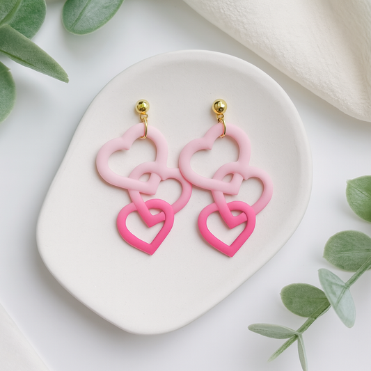 Interlocking Heart Dangle Earrings handmade using polymer clay