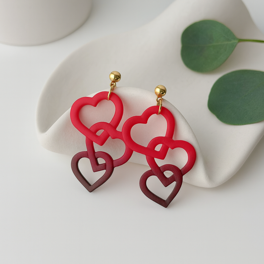interlocked hearts earrings handmade using polymer clay