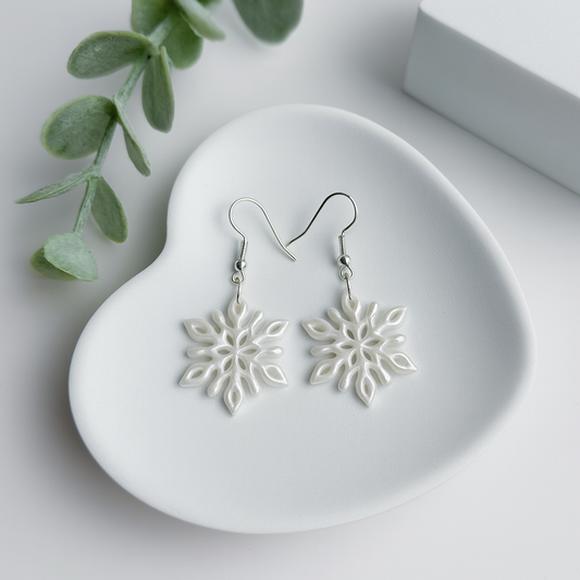 snowflake earrings handmade using polymer clay